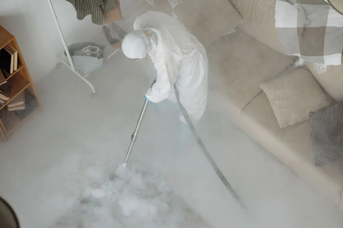 Biohazard cleanup technician in protective equipment, Arlington, TN